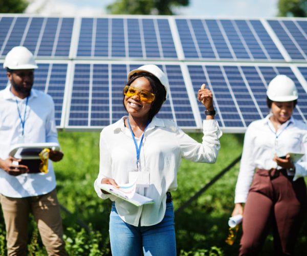 african-american-technician-checks-maintenance-solar-panels-group-three-black-engineers-meeting-solar-station